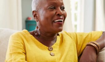 Image of lady in yellow top smiling