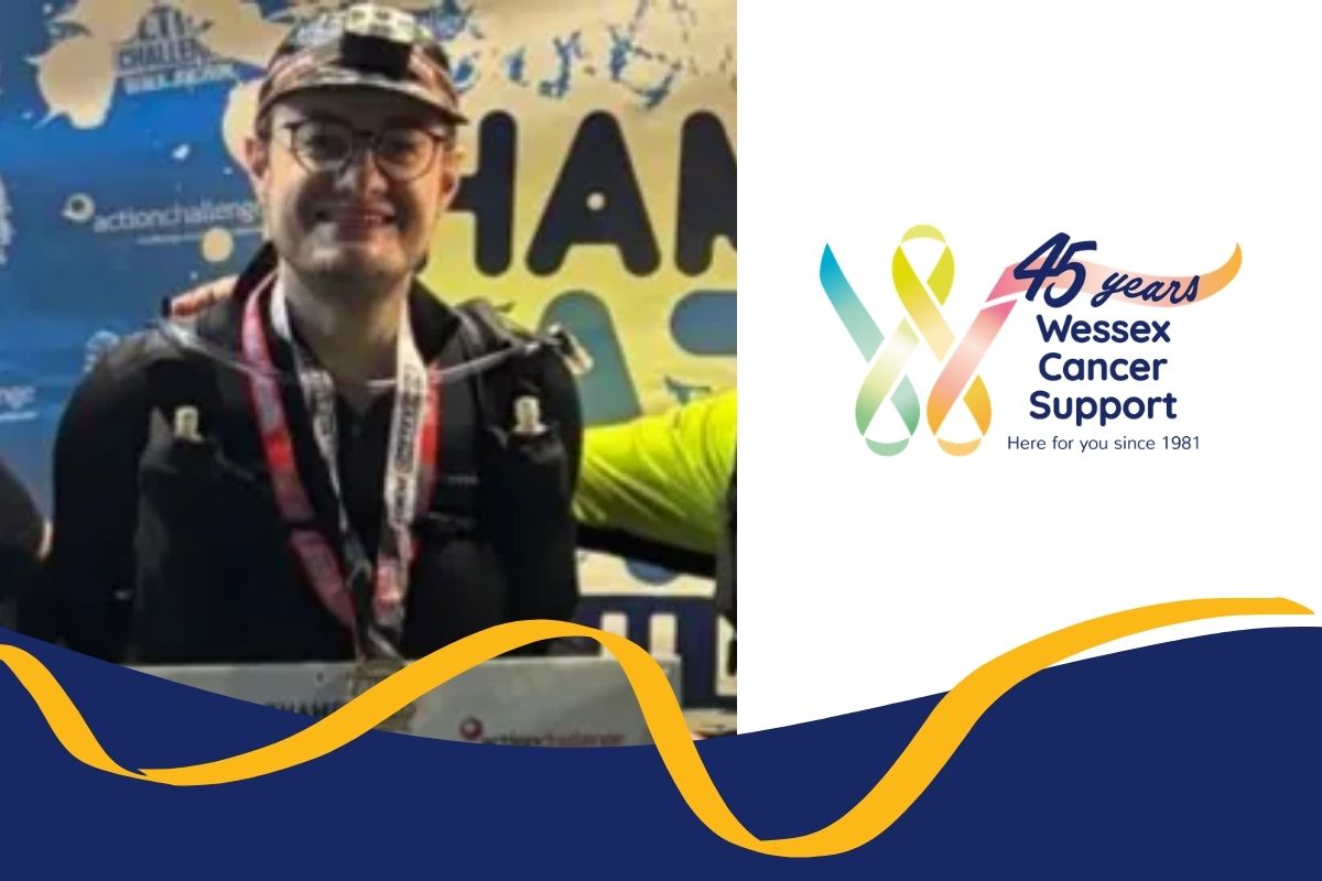 photo shows liam wearing a cap and medals around his neck smiling to the camera