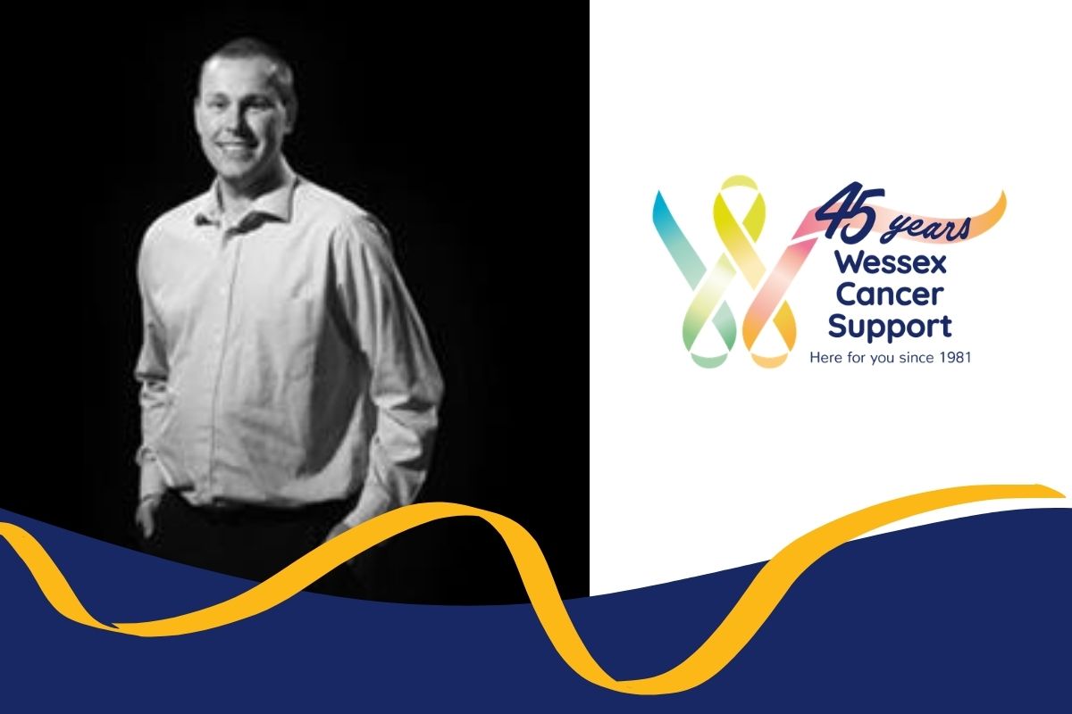 Photo shows a black and white shot of Mark from the waist up facing camera