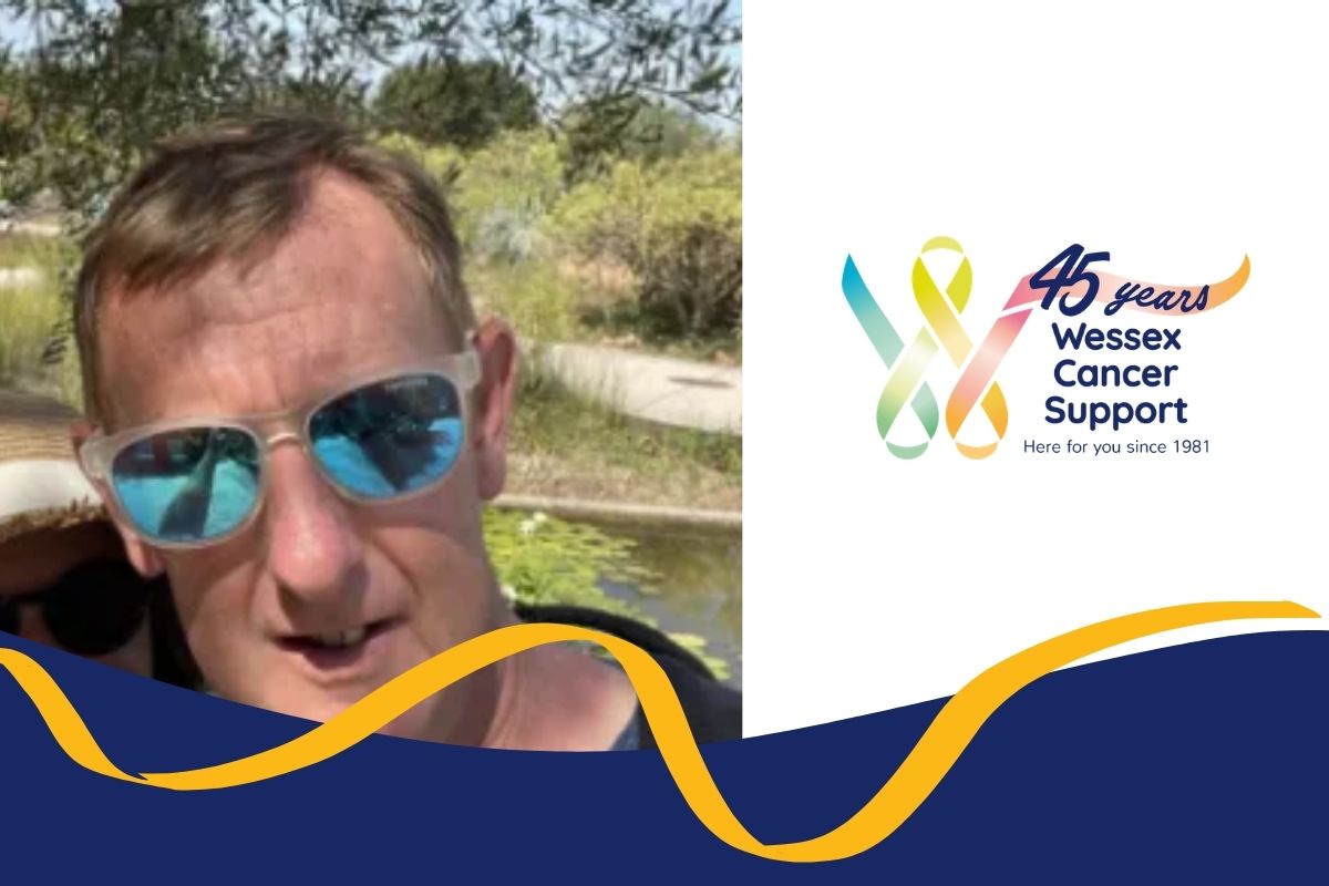 Photo shows Patrick from the shoulders up wearing sunglasses and looking to camera