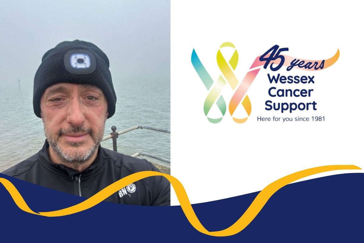 photo shows Paul wearing a hat with a head torch on it, facing camera