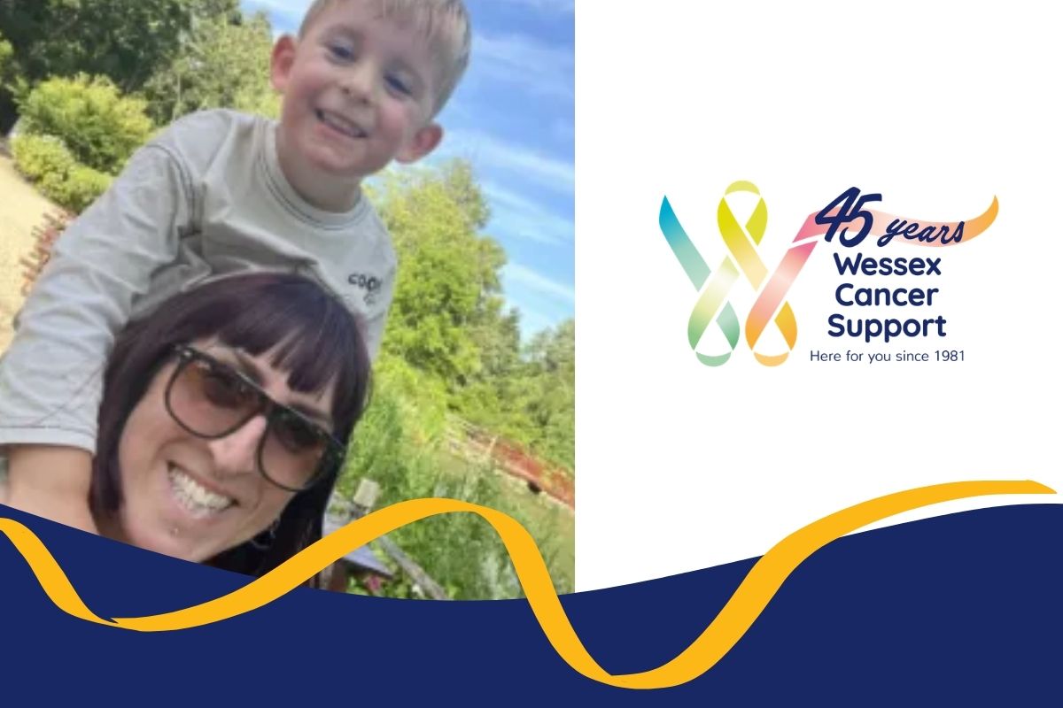 photo shows Zia, wearing sunglasses, with a boy on her shoulders. Both are smiling to the camera.